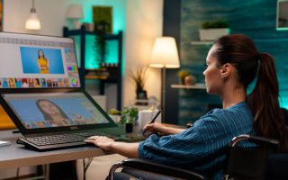 Retouching specialist working on graphic project at studio