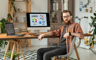 Handsome brand designer at desk